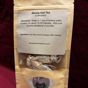 A tea package with Bloody Earl tea bags inside on a red background.